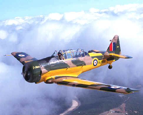 John Hyle's North American Harvard (T-6), above the clouds over Texas.
